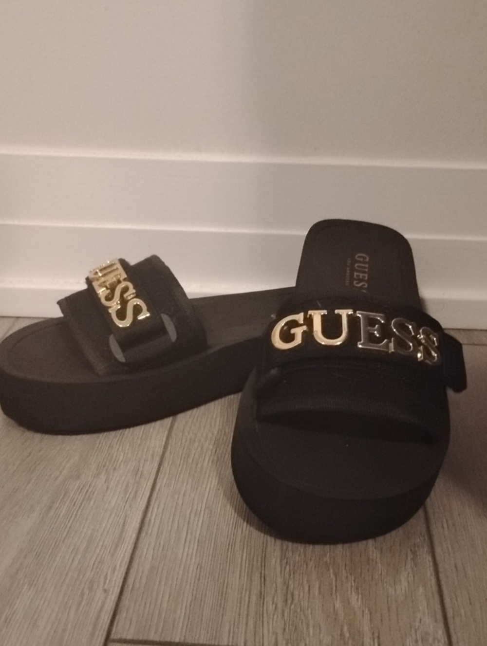 GUESS Black Slides with Gold Logo Accent